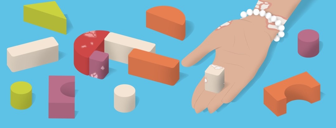 blocks in the shape of a question mark and some have psoriasis and a woman holding a block and she has psoriasis