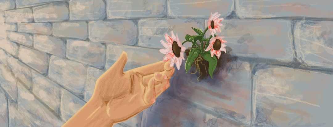 A hand gently lifts up a wilting wallflower with plaque psoriasis.