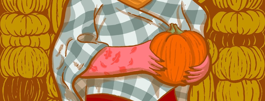 A woman wearing a plaid poncho holding a pumpkin. On her arm are plaques that look like falling and blowing leaves.