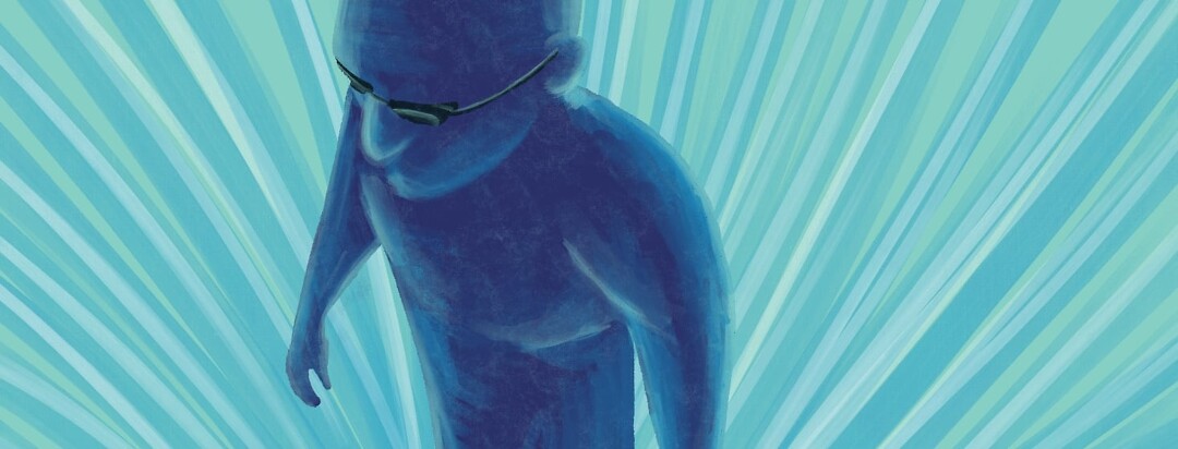 A male figure in a UV light therapy room.