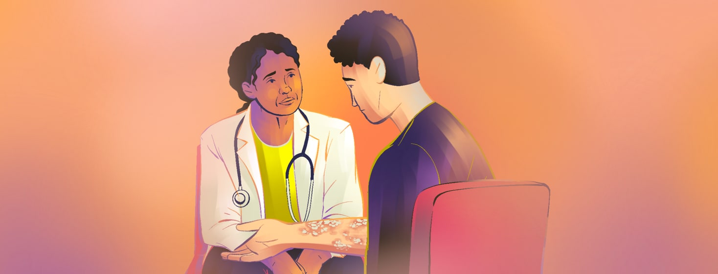 alt=a concerned doctor listens to an anxious man with psoriasis on his arm.