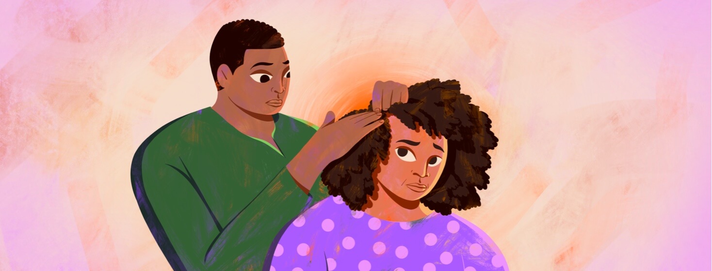 alt=a woman's partner checks her scalp for the return of psoriasis