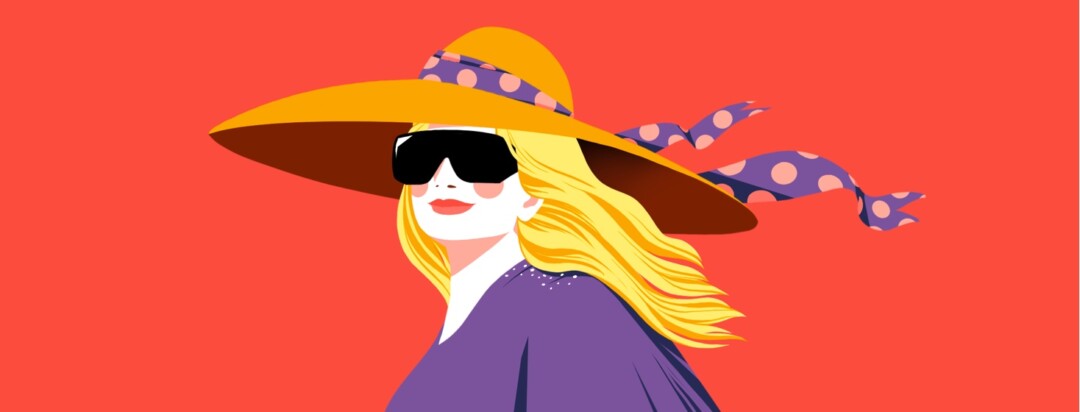 A smiling woman in a bright space is wearing a large sun hat with a ribbon blowing in the wind as psoriasis flakes rest on her shoulder